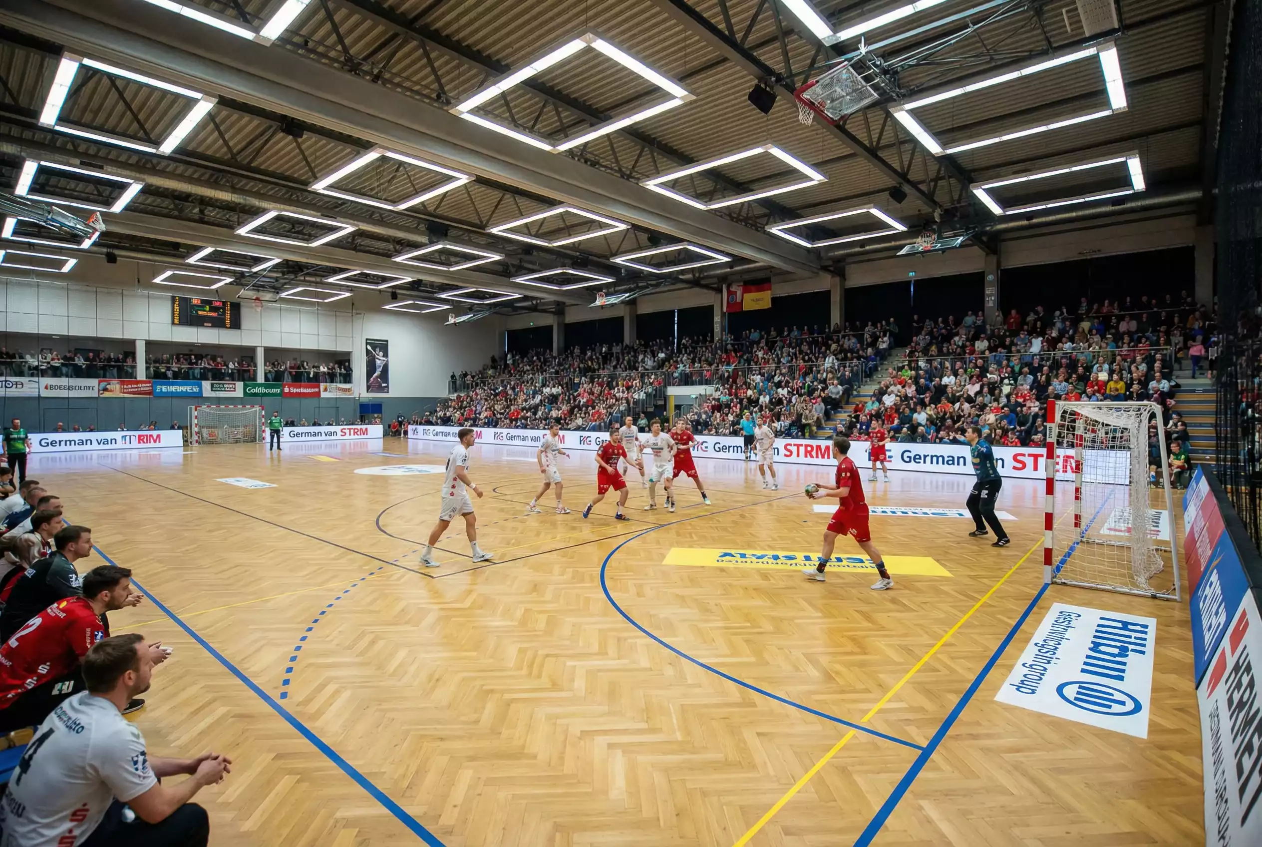 Handball-Bundesliga-Saison 2025/26 — Spieler am Spielfeld während eines Bundesliga-Spiels